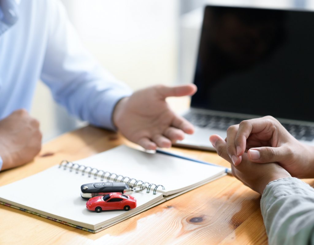 Insurance broker is recommending auto accident insurance to clients.